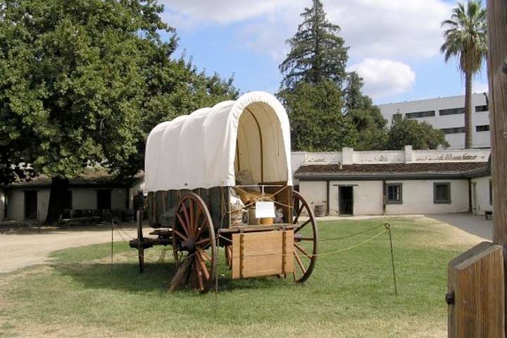 covered wagon inside the eastern yard of Sutter's Fort