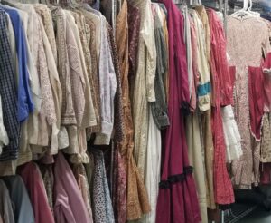 historic costumes hanging from clothing racks