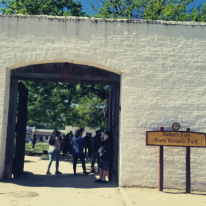 Gates open at Sutter's Fort with sign 