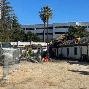 Construction crews remove old shingles from the Southeast bastion 