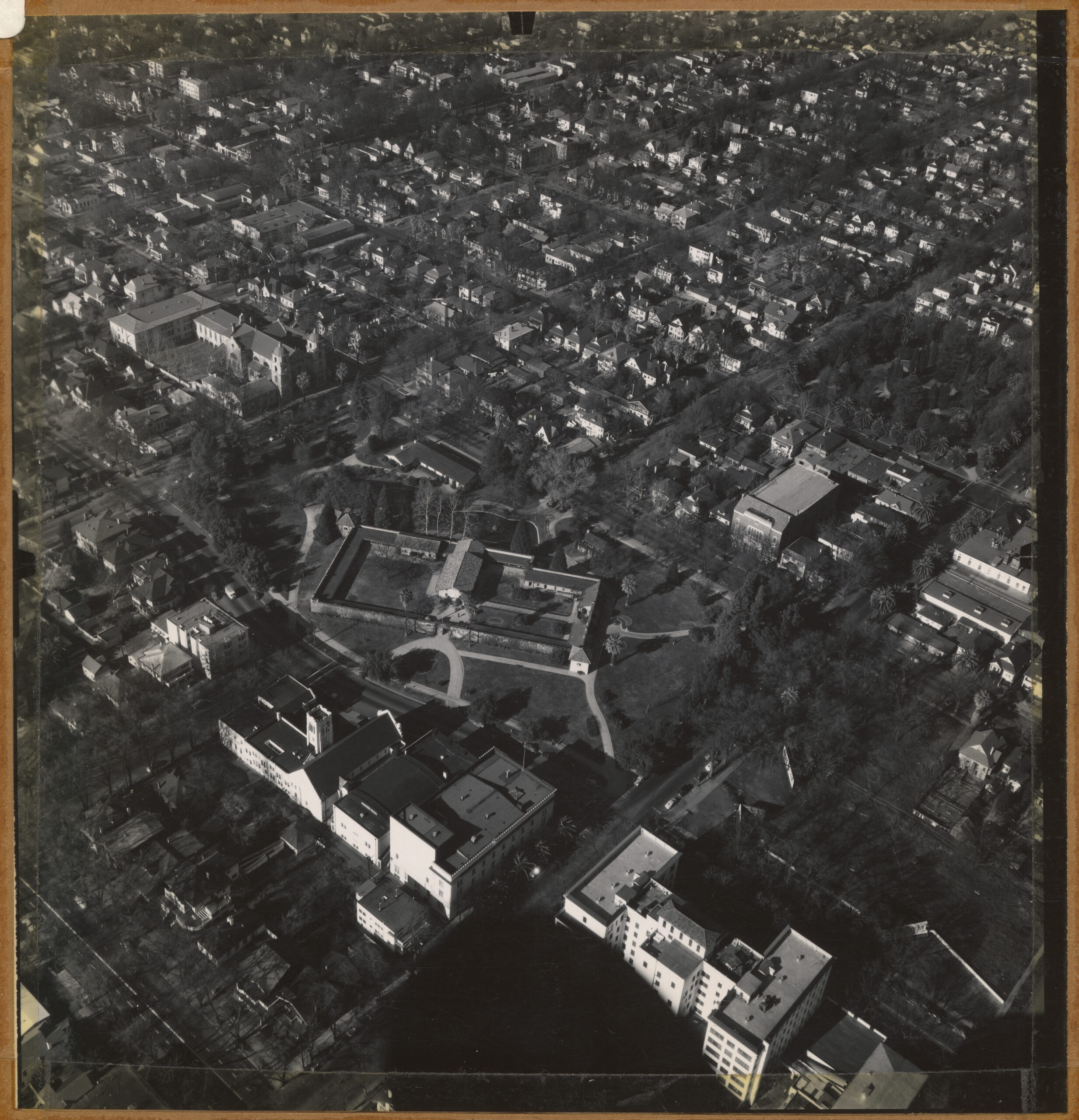 Ariel Photograph from the 1940s shows Sutter's Fort and L St. to about G St.; 28th west towards 23rd. Marshall Park, Sutter Hospital, St. Francis of Assisi Parish Church and the Pioneer Congregational Church of Christ